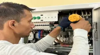 RV electrical repair technician fixing battery and wiring issues in Yuma AZ